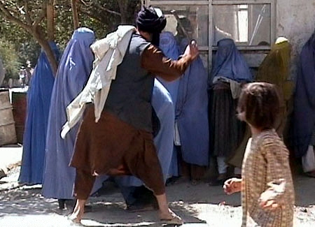 Taliban beating woman in public Image RAWA