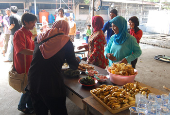 Workers offered the international delegation a meal, which they had cooked themselves in a corner of the factory yard.