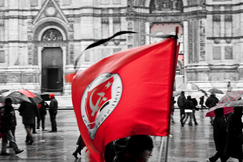 Communist flag in the general strike in Bologna (Photo by spaceodissey on flickr)