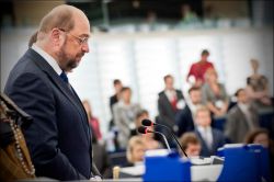 The European Parliament holding a minute of silence with its president in the foreground. Photo: European Union 2013 - European Parliament