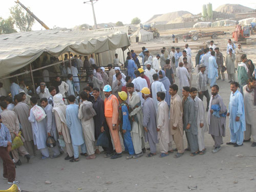 Workers at Taunsa Barrage queuing up for morning shift