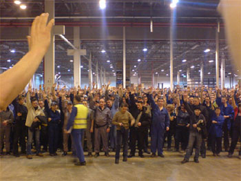 The factory meeting voting for, and beginning, the strike.