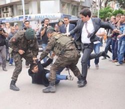erdogan-aide-kicks-protester