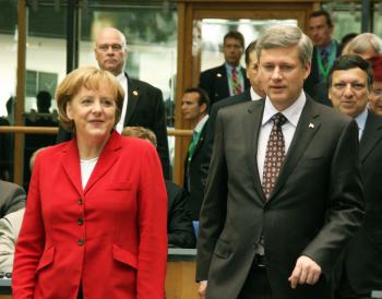Stephen Harper (right) is heading a government with record number of female ministers but this has not improved the situation for women. The same can be said for Germany's first female Prime Minister, who has presided over huge cuts in the welfare state. Photo by franz88 on Flickr.