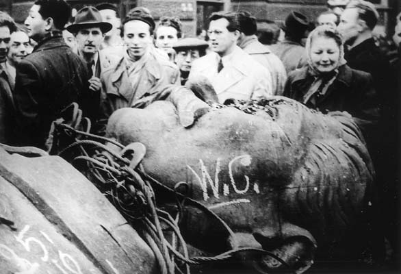 A photo of the head of the statue of Joseph Stalin desecrated during the 1956 Hungarian Revolution before the invasion of the Red Army crushing the revolution.