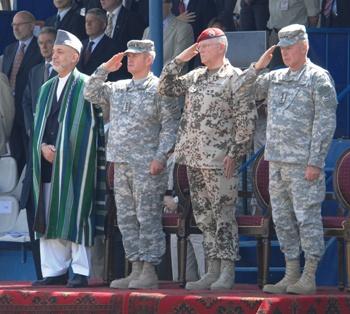 Karzai and the commanders of the international forces in Afghanistan. Photograph by Sgt. Andrew E. Lynch.