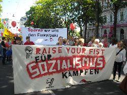 banner at may day rally in vienna
