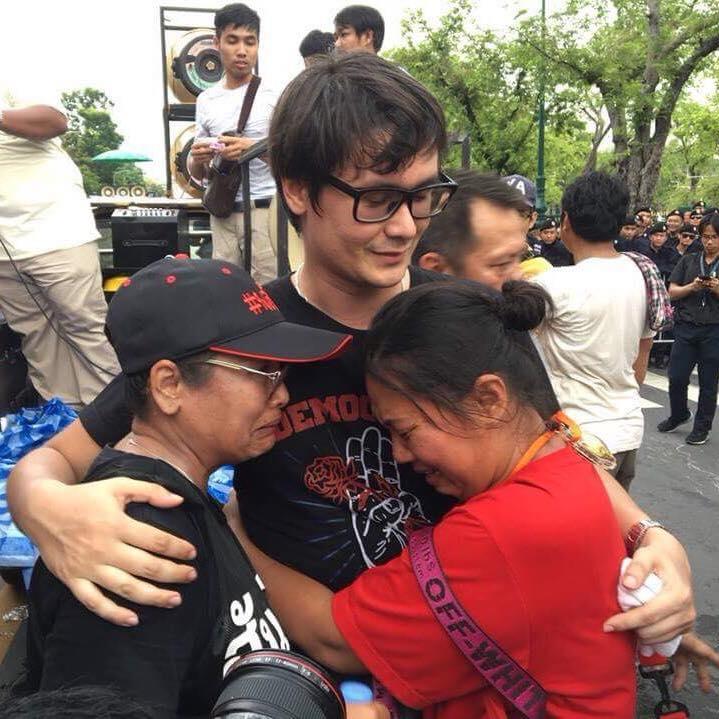Protesters crying and hugging leader Rangsiman Rome after he called an end to the demonstration